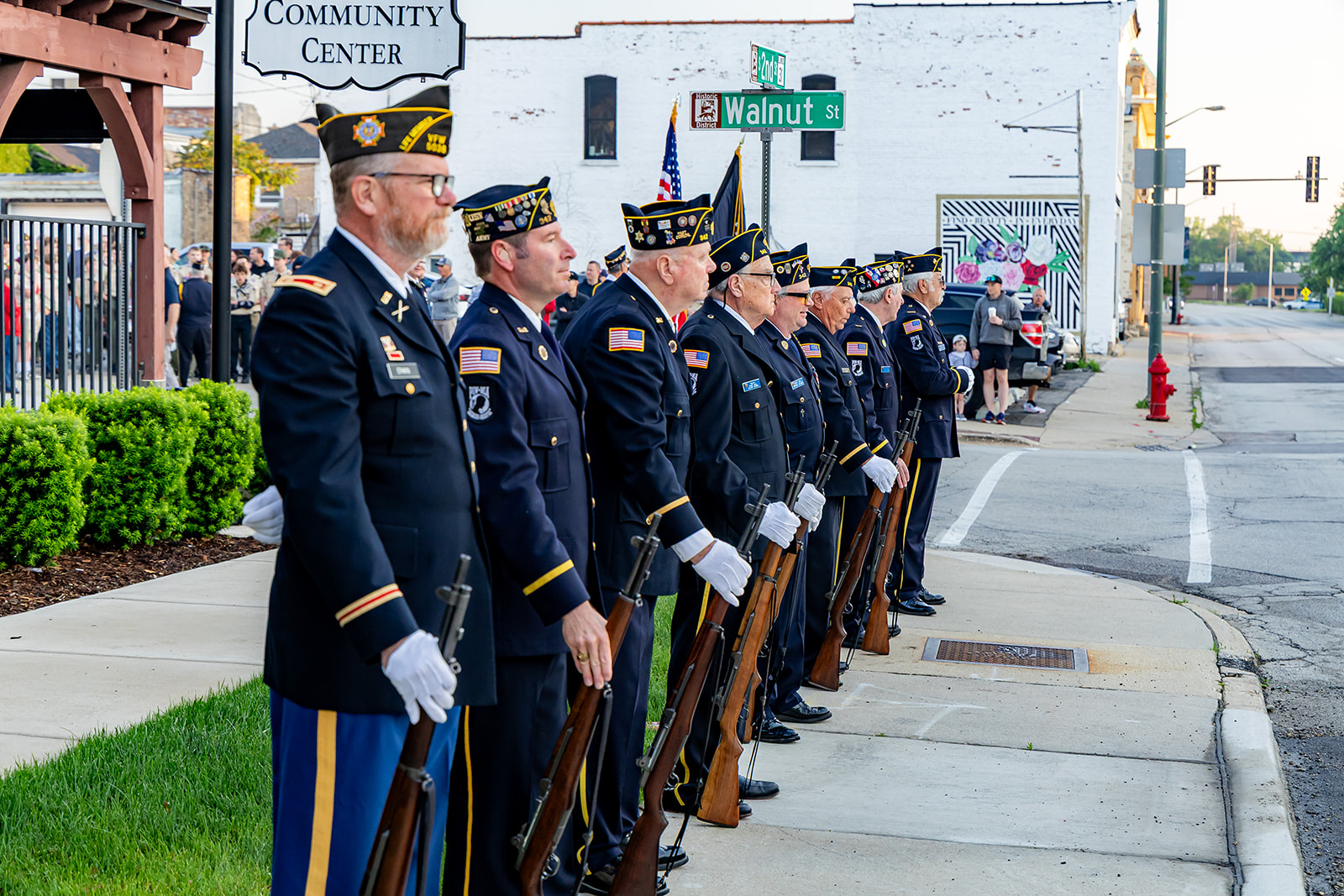 Local veterans stand in formation during a St. Charles remembrance