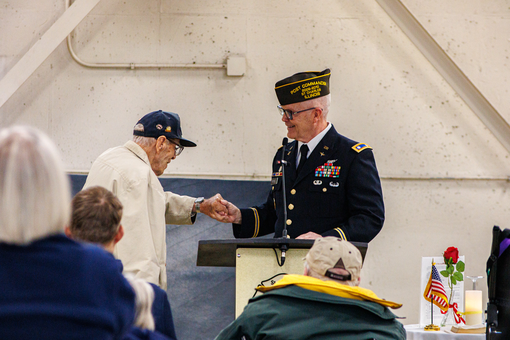 Two local veterans greet one another at a Post 5036 gathering